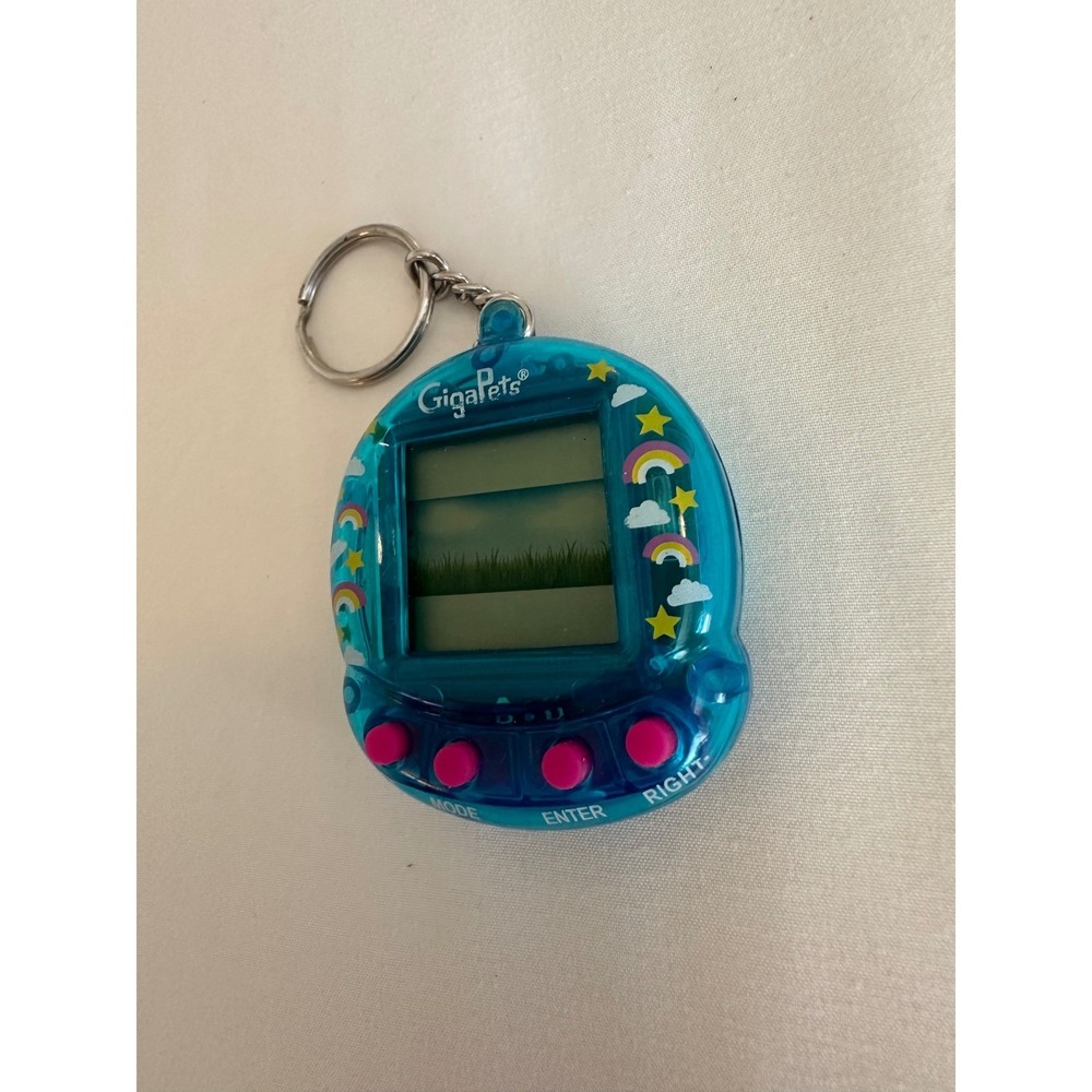 GigaPets Virtual Pet Handheld Game Translucent Blue Rainbow 1563HF01 Retro Toy